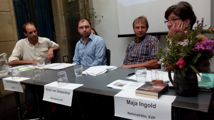 Podiumsdiskussion über Migration von Christen.