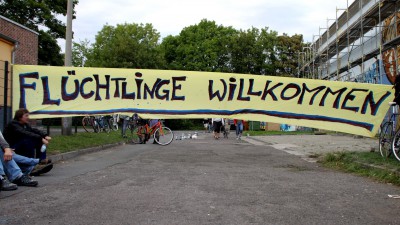 Evangelische Kirche lobt Angela Merkels Willkommenskultur für Flüchtlinge.